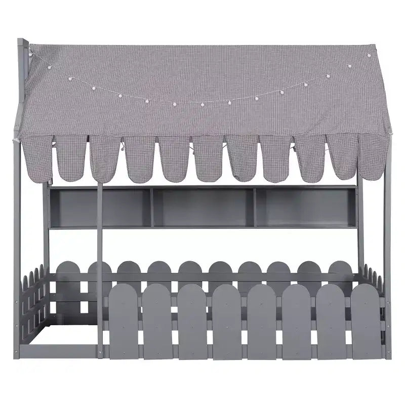 Lit cabane avec barrières et toit de tente